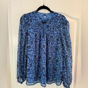 Beautifully detailed and feminine long sleeve blue paisley print blouse.